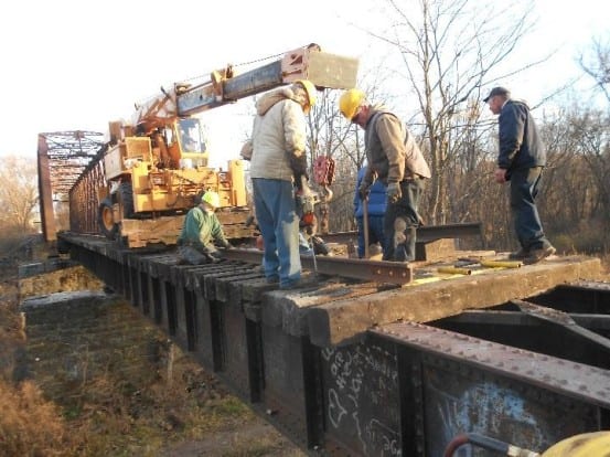 Volunteers repair the C9 Bridge